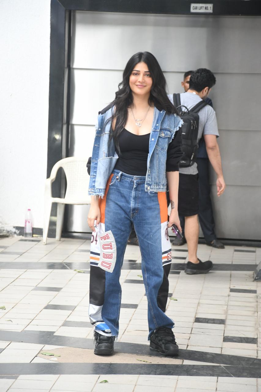 Shruti Haasan made an appearance in the city today as she was tapped outside a dubbing studio. She aced a denim jacket and pant with a black vest.